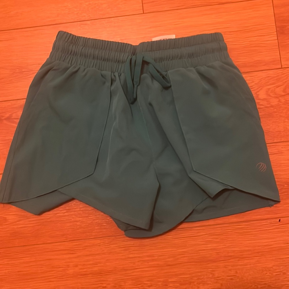 Teal green running shorts